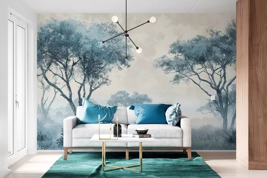 wall murals A misty, serene landscape with silhouetted trees in the foreground with soft fog in shades of blue and beige w08442
