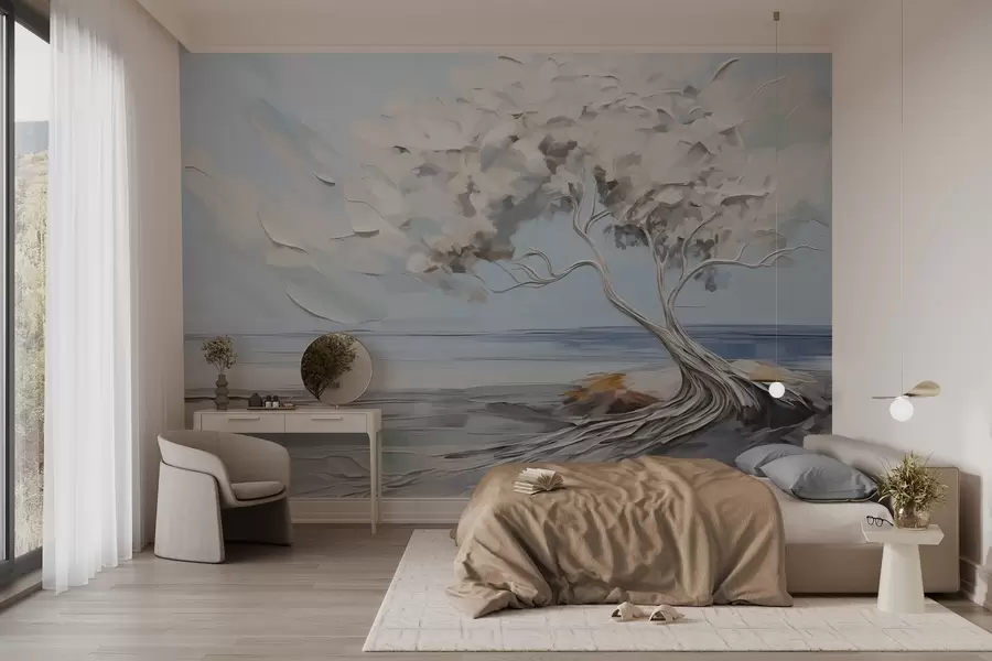 wall murals A white tree with thick and textured leaves on a sandy beach, landscape with a light blue sky w09205