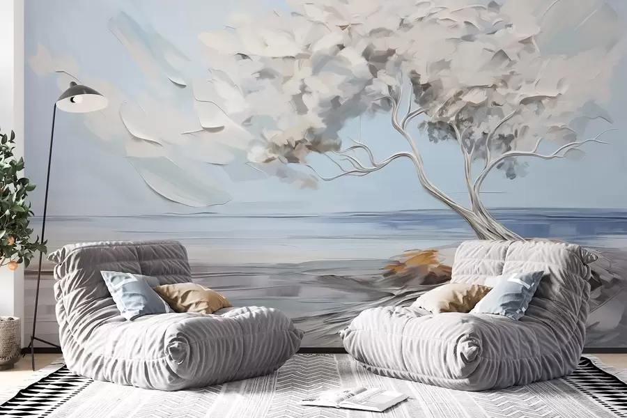 Wall Mural Photo Wallpaper A white tree with thick and textured leaves on a sandy beach, landscape with a light blue sky w09205