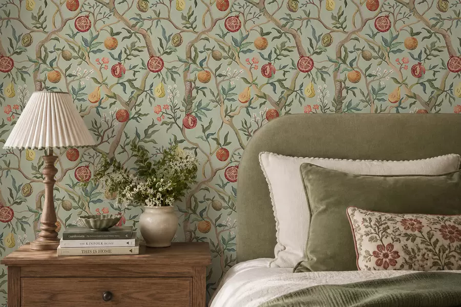 wall murals Pomegranate fruits, pears and flowers on a pale green background a00465