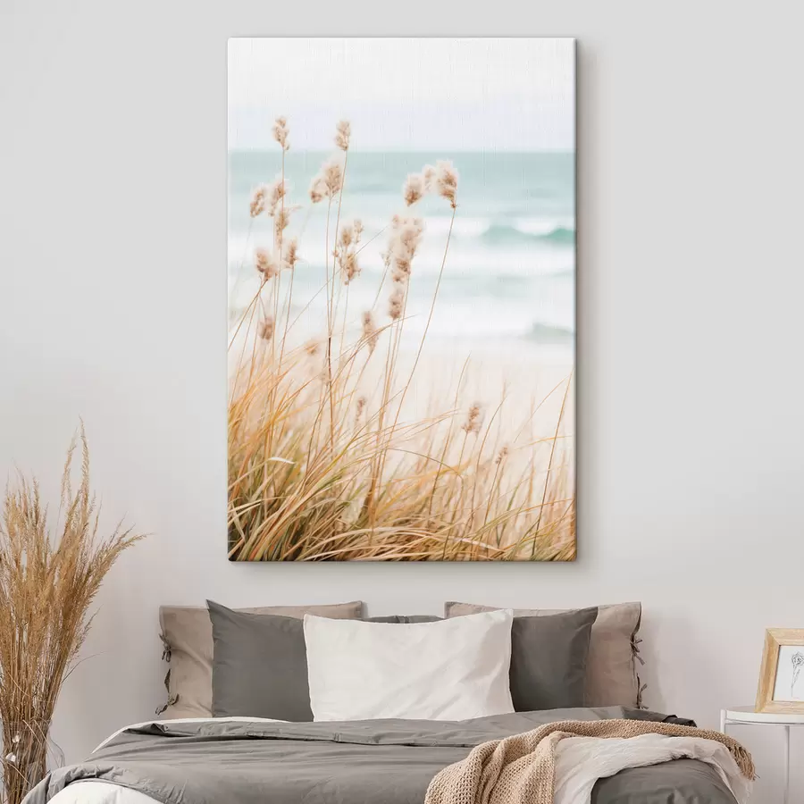 wall murals Tall grass with fluffy seed heads, sandy beach and ocean waves in the background, soft and muted color palette s45561