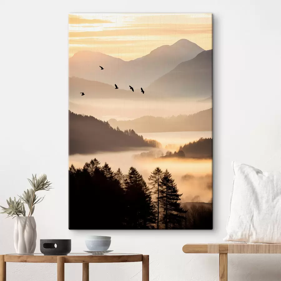 wall murals A mountain landscape with a forest and birds flying in the sky , all covered in a thick layer of fog during sunrise s45564